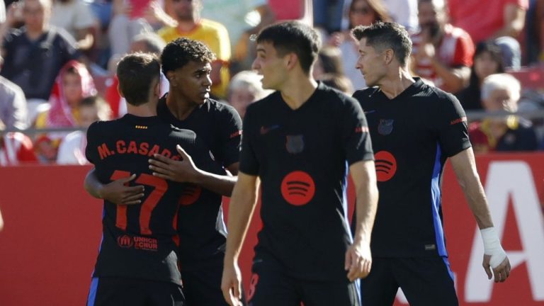 Barcelona's Lamine Yamal celebrates with his teammates after scoring his side's opening goal during the Spanish La Liga soccer match between Girona and Barcelona at the Montilivi stadium in Girona, Spain, Sunday, Sept. 15, 2024. (Joan Monfort/AP Photo)
