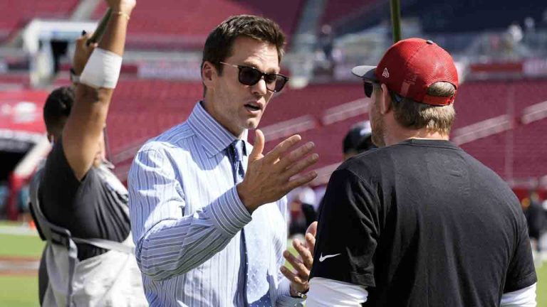 Former quarterback Tom Brady, left, talks to Tampa Bay Buccaneers offensive coordinator Liam Coen before an NFL football game between the Buccaneers and the Philadelphia Eagles Sunday, Sept. 29, 2024, in Tampa, Fla. (Chris O'Meara/AP)