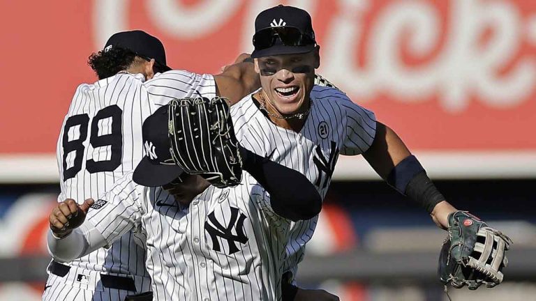 New York Yankees center fielder Aaron Judge, right, celebrates with Juan Soto, front, and Jasson Dominguez (89) after a baseball game. (Adam Hunger/AP)
