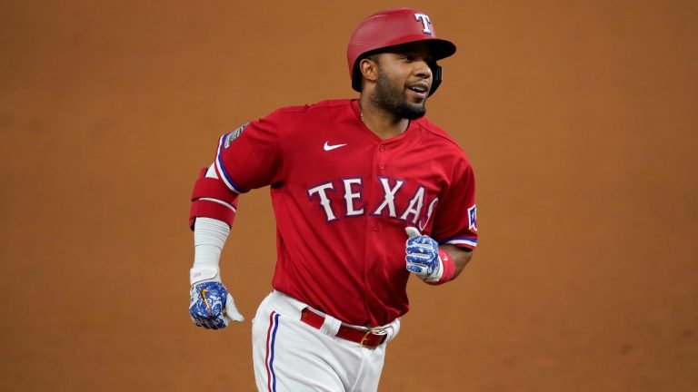 Texas Rangers' Elvis Andrus rounds third on his way home after hitting a solo home run against the Oakland Athletics in the seventh inning of a baseball game in Arlington, Texas, Friday, Sept. 11, 2020. (Tony Gutierrez/AP)