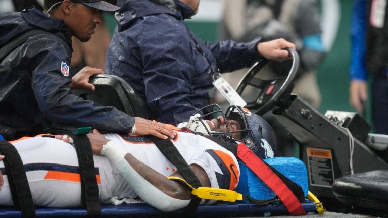 Denver Broncos running back Tyler Badie (28) is taken off the field after an injury against the New York Jets during the second quarter of an NFL football game, Sunday, Sept. 29, 2024, in East Rutherford, N.J. (Bryan Woolston/AP Photo)