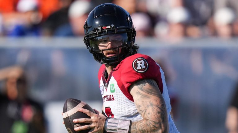 Ottawa Redblacks quarterback Dru Brown prepares to pass during the first half of a CFL football game against the B.C. Lions. (Darryl Dyck/CP)