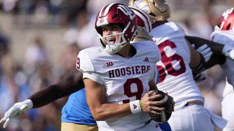 Indiana quarterback Kurtis Rourke avoids a tackles as he rolls out during the first half of an NCAA college football game against UCLA, Saturday, Sept. 14, 2024, in Pasadena, Calif. (Mark J. Terrill/AP)