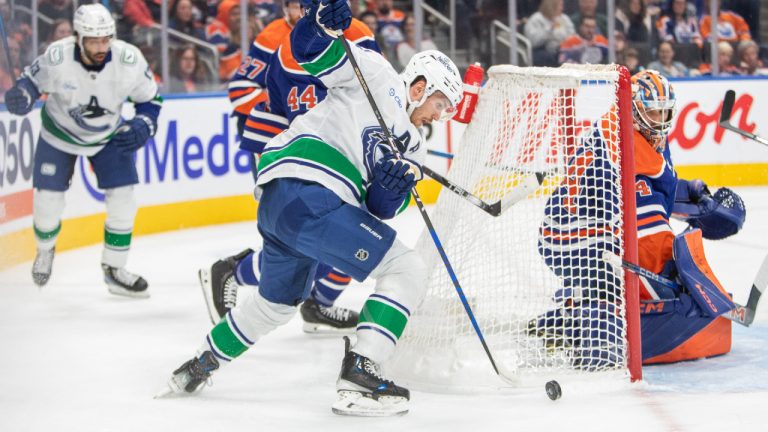 Vancouver Canucks Pius Suter looks for a shot against Edmonton Oilers goalie Stuart Skinner (74) during first period NHL pre-season action in Edmonton on Monday, September 30, 2024. (Amber Bracken/CP)