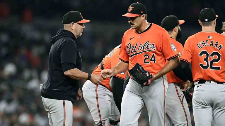 Baltimore Orioles manager Brandon Hyde, left, takes the ball from starting pitcher Zach Eflin (24) in the seventh inning of a baseball game against the Detroit Tigers, Friday, Sept. 13, 2024, in Detroit. (Jose Juarez/AP)