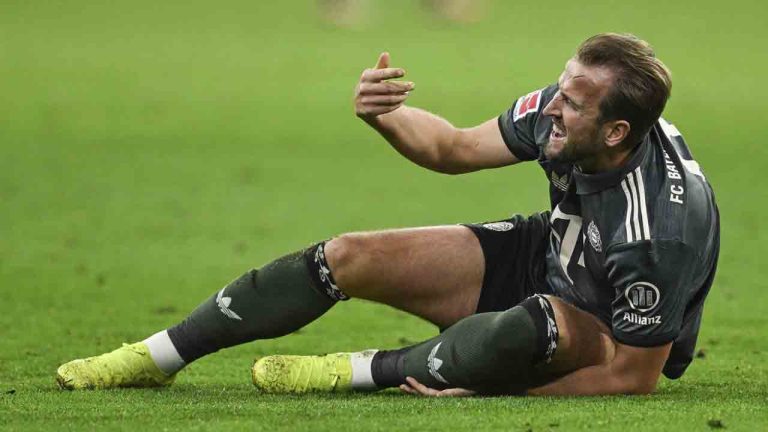 Munich's Harry Kane lies on the pitch in pain during the German Bundesliga soccer match between Bayern Munich and Leverkusen at the Allianz Arena in Munich, Germany, Saturday, Sept. 28, 2024. (Sven Hoppe/dpa via AP)