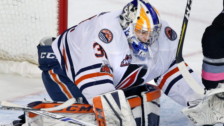 Kamloops Blazers goalie Dylan Ferguson makes a save during WHL (Western Hockey League) hockey action against the Calgary Hitmen in Calgary, Alta., on Friday, Jan. 19, 2018. (Larry MacDougal/CP)