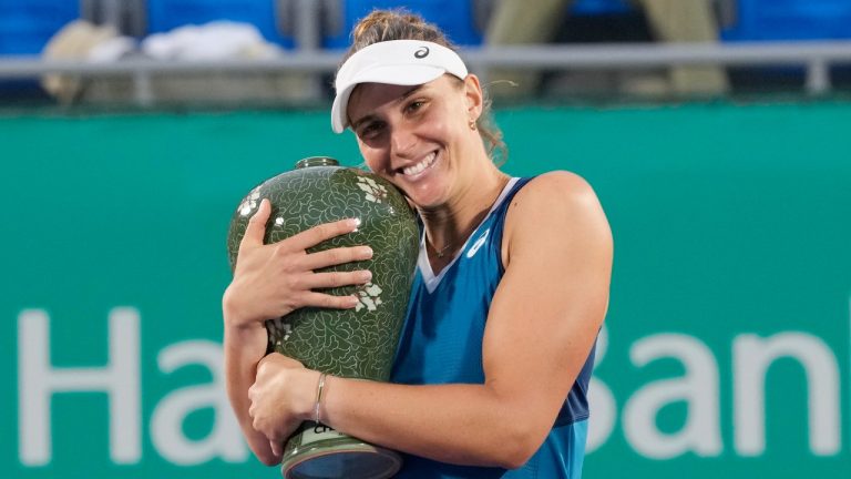 Beatriz Haddad Maia of Brazil holds her trophy after defeating Daria Kasatkina of Russia during their final match of the Korea Open tennis championships at Olympic Park Tennis Court in Seoul, South Korea, Sunday, Sept. 22, 2024. (Ahn Young-joon/AP)