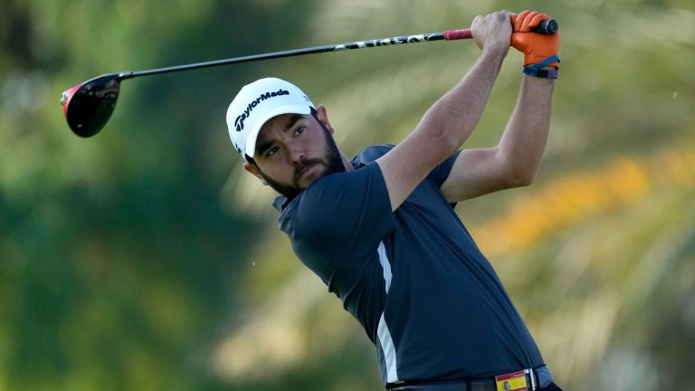 Angel Hidalgo of Spain tees off on the 12th hole during the completion of his second round on Day Three of the Dubai Desert Classic, in Dubai, United Arab Emirates, Saturday, Jan. 28, 2023. (Kamran Jebreili/AP)