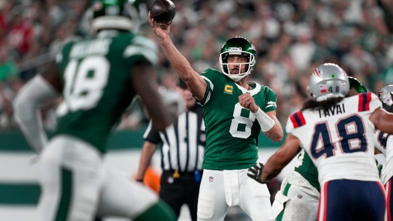 New York Jets quarterback Aaron Rodgers (8) passes against the New England Patriots during the second quarter of an NFL football game, Thursday, Sept. 19, 2024, in East Rutherford, N.J. (Julia Demaree Nikhinson/AP)