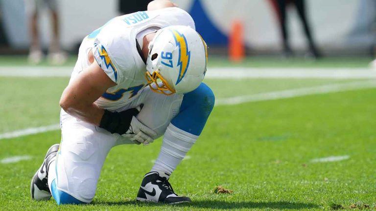 Los Angeles Chargers linebacker Joey Bosa holds his leg during the first half of an NFL football game against the Pittsburgh Steelers. (Matt Freed/AP)