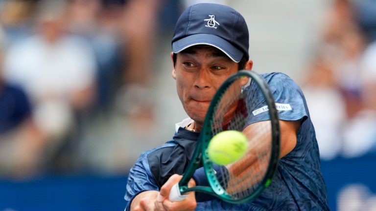 Mackenzie McDonald, of the United States, returns a shot to Jannik Sinner, of Italy, during the first round of the U.S. Open tennis championships, Tuesday, Aug. 27, 2024, in New York. (Kirsty Wigglesworth/AP)