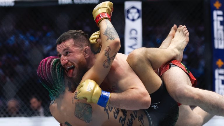 Merab Dvalishvili, top, fights Sean O'Malley in a bantamweight mixed martial arts title bout during UFC 306 at the Sphere, Saturday, Sept. 14, 2024, in Las Vegas. (Wade Vandervort/Las Vegas Sun via AP)