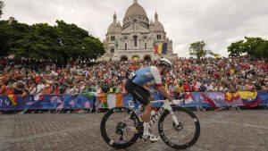 Michael Woods, of Canada, rides past the Sacre Coeur Basilica, during the men's road cycling event, at the 2024 Summer Olympics. (Vadim Ghirda/THE CANADIAN PRESS)
