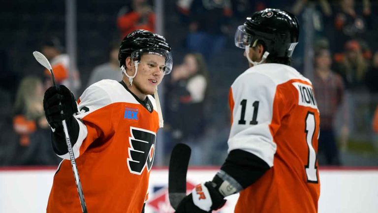 Philadelphia Flyers' Matvei Michkov, left, and Travis Konecny celebrate after a preseason NHL hockey game against the New York Islanders. (Matt Slocum/AP)