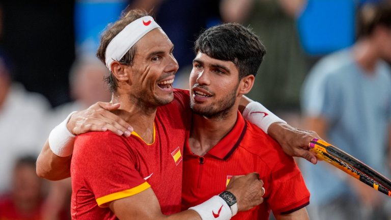 Rafael Nadal, left, and Carlos Alcaraz of Spain react after losing against Austin Krajicek and Rajeev Ram of the USA during the men's doubles quarter-final tennis competition at the Roland Garros stadium, at the 2024 Summer Olympics, Wednesday, July 31, 2024, in Paris, France. (Manu Fernandez/AP)