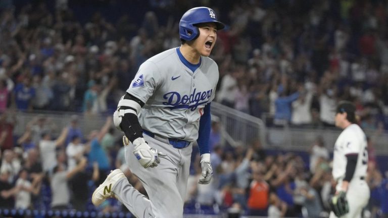 Los Angeles Dodgers' Shohei Ohtani (17) reacts after hitting his 50th home run of the season during the seventh inning of a baseball game against the Miami Marlins, Thursday, Sept. 19, 2024, in Miami. (Marta Lavandier/AP Photo)
