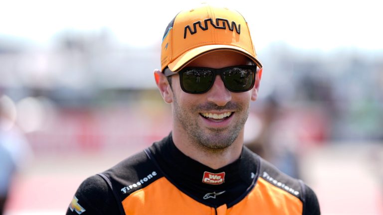 Alexander Rossi walks to driver introductions before an IndyCar auto race, Sunday, July 14, 2024, at Iowa Speedway in Newton, Iowa. (Charlie Neibergall/AP)