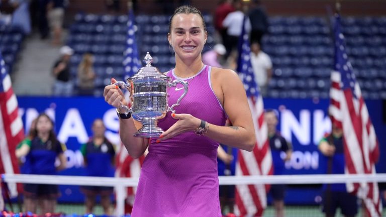 Aryna Sabalenka, of Belarus, holds the trophy after winning the women's singles final of the U.S. Open tennis championships against Jessica Pegula, of the United States, , Saturday, Sept. 7, 2024, in New York. (Frank Franklin II/AP)