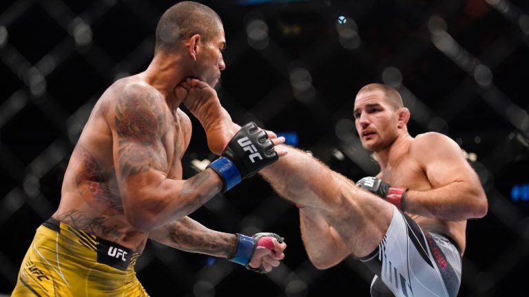 Sean Strickland kicks Alex Pereira in a middleweight bout at UFC 276 in 2022 in Las Vegas. (John Locher/AP)