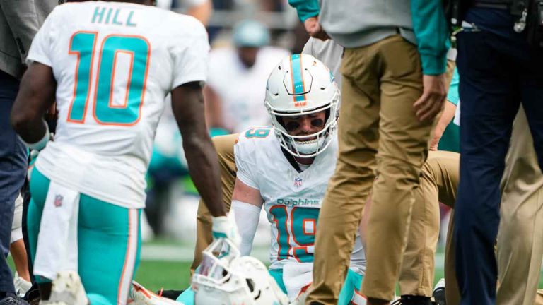 Miami Dolphins quarterback Skylar Thompson (19) is evaluated on the field after a play during the second half of an NFL football game against the Seattle Seahawks. (Lindsey Wasson/AP)