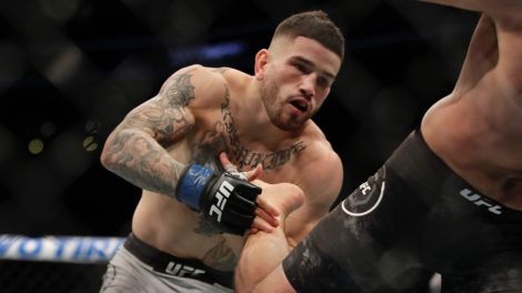 Sean-Brady-takes-a-foot-to-the-chest-during-a-welterweight-mixed-martial-arts-bout-at-a-UFC-Fight-Night-event