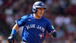 Toronto Blue Jays' Daulton Varsho dashes down the first base line on his single during the fifth inning of a baseball game against the Boston Red Sox at Fenway Park, Monday, Aug. 26, 2024, in Boston. (Charles Krupa/AP)