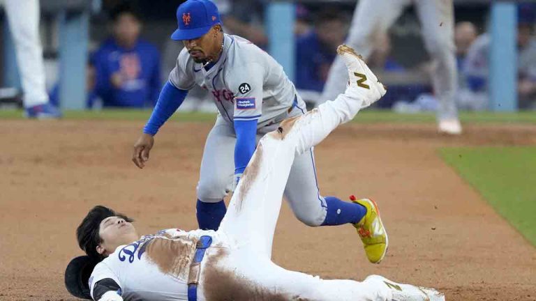 Los Angeles Dodgers' Shohei Ohtani steals second base past New York Mets shortstop Francisco Lindor during the second inning in Game 1 of a baseball NL Championship Series, Sunday, Oct. 13, 2024, in Los Angeles. (Mark J. Terrill/AP)