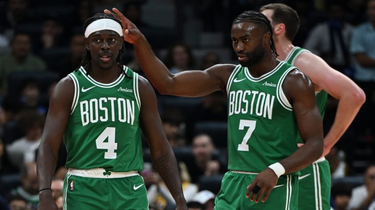 Boston Celtics Jrue Holiday, left, and Boston Celtics Jaylen Brown stand during a preseason game between Boston Celtics and Denver Nuggets in Abu Dhabi, United Arab Emirates, Friday, Oct. 4, 2024. (Martin Dokoupil/AP)