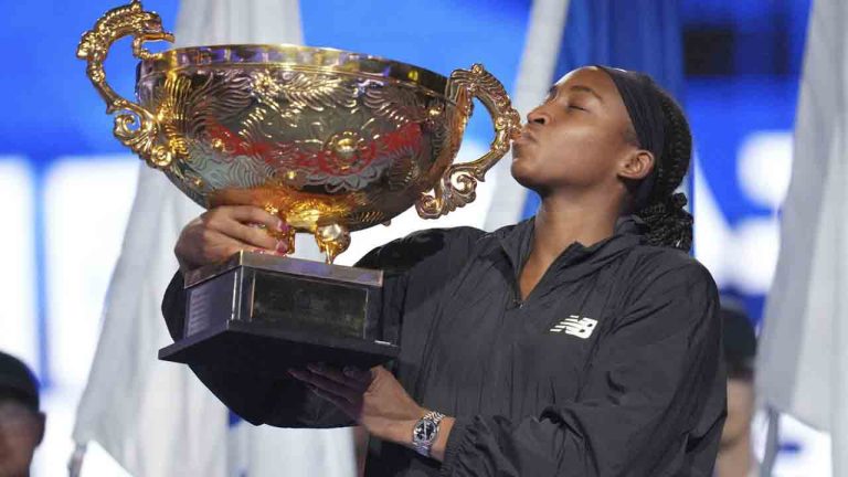 Coco Gauff of the United States kisses the trophy after defeating Karolina Muchova of Czech Republic in the women's singles final match at the China Open tennis tournament at the National Tennis Center in Beijing, Sunday, Oct. 6, 2024. (Achmad Ibrahim/AP)