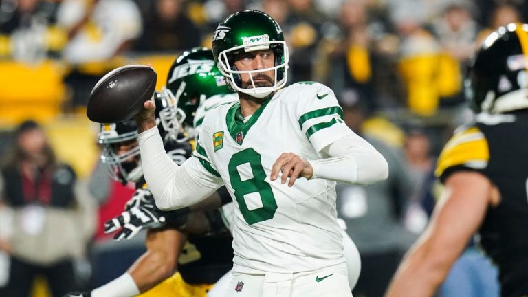 New York Jets quarterback Aaron Rodgers (8) drops back to pass in the first half of an NFL football game against the Pittsburgh Steelers in Pittsburgh, Sunday, Oct. 20, 2024. (Matt Freed/AP Photo)