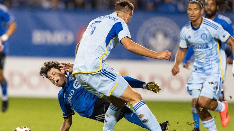 CF Montreal midfielder Caden Clark (left) is challenged by Atlanta United defender Stian Gregersen (5) during first half MLS playoff soccer action in Montreal, Tuesday, October 22, 2024. (Christinne Muschi/CP)