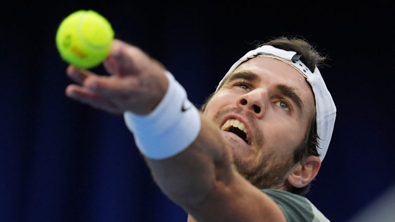 Karen Khachanov of Russia serves against Carlos Alcaraz of Spain during the China Open tennis tournament held at the National Tennis Centre in Beijing, Monday, Sept. 30, 2024. (Ng Han Guan/AP) 