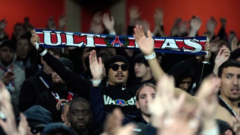 PSG fans cheer on the stands before the start of a Champions League opening phase soccer match between Arsenal FC and Paris Saint-Germain at Arsenal stadium in London, England, Tuesday, Oct. 1, 2024. (Alastair Grant/AP) 