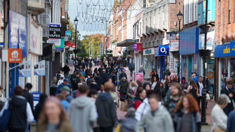 Members of the public walk through the center of Wrexham, Wales, Monday, Oct. 7, 2024. (Jon Super/AP) 