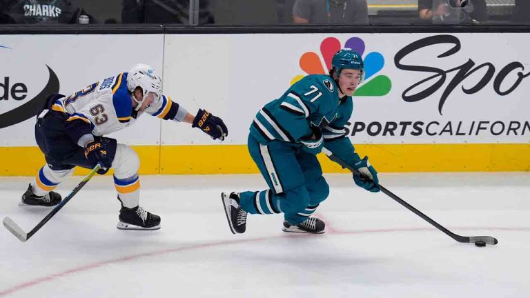 St. Louis Blues left wing Jake Neighbours, left, chases after San Jose Sharks center Macklin Celebrini, right, during the first period of an NHL hockey game Thursday, Oct. 10, 2024, in San Jose, Calif. (Godofredo A. Vásquez/AP)