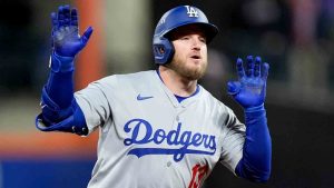 Los Angeles Dodgers' Max Muncy celebrates a home run against the New York Mets during the ninth inning in Game 3 of a baseball NL Championship Series.(Frank Franklin II/AP)