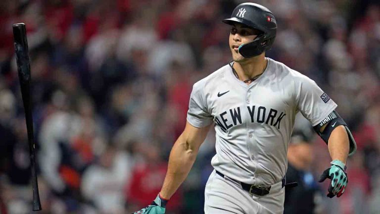 New York Yankees' Giancarlo Stanton tosses his bat after hitting a three-run home run against the Cleveland Guardians during the sixth inning in Game 4 of the baseball AL Championship Series Friday, Oct. 18, 2024, in Cleveland. (Godofredo A. Vásquez/AP)