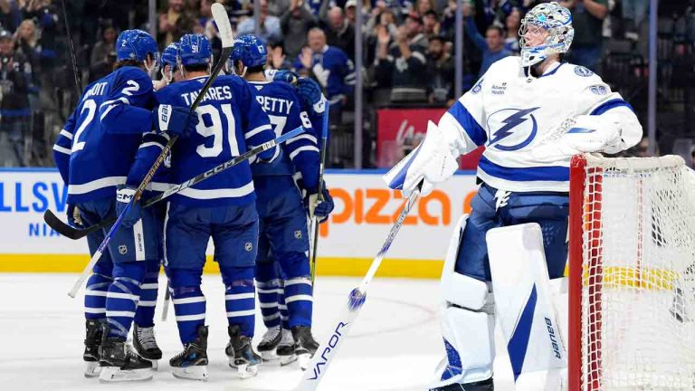 Tampa Bay Lightning goalie Andrei Vasilevskiy (88) looks on from the goal after being scored on by Toronto Maple Leafs left wing Max Pacioretty (67), who celebrates with teammates during second period NHL hockey action in Toronto, Monday, Oct. 21, 2024. (Frank Gunn/CP)