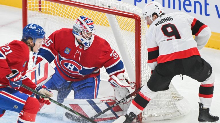 Ottawa Senators' Josh Norris (9) moves in on Montreal Canadiens goaltender Sam Montembeault as Canadiens' Kaiden Guhle defends during first period NHL hockey action in Montreal, Saturday, Oct. 12, 2024. (Graham Hughes/CP)