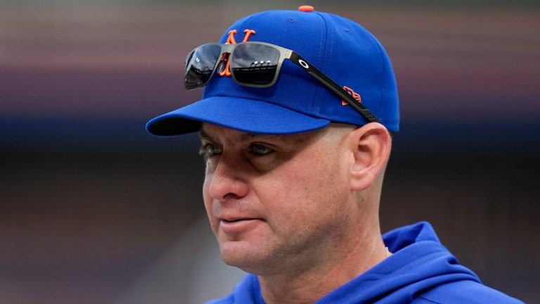 New York Mets manager Carlos Mendoza watches batting practice before Game 3 of the National League baseball playoff series against the Philadelphia Phillies, Tuesday, Oct. 8, 2024, in New York. (AP/Frank Franklin II)