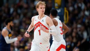 Toronto Raptors guard Gradey Dick (1) reacts after hitting a 3-point basket against the Denver Nuggets in the first half of an NBA basketball game Monday, March 11, 2024, in Denver. (David Zalubowski/AP Photo)