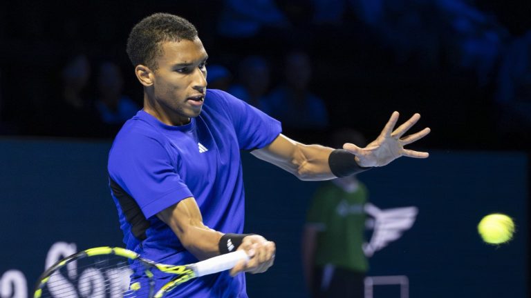 Canada's Felix Auger-Aliassime returns a ball to Argentina's Sebastian Baez during their first round match at the Swiss Indoors tennis tournament, at the St. Jakobshalle in Basel, Switzerland, on Wednesday, Oct. 23, 2024. (Georgios Kefalas/Keystone via AP)