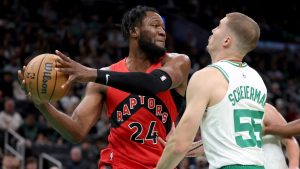 Toronto Raptors centre Bruno Fernando (24) defends the ball from Boston Celtics forward Baylor Scheierman (55). (Mark Stockwell/AP)