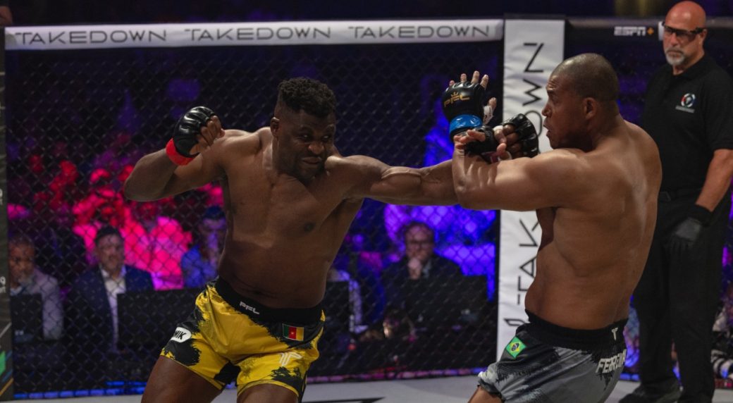 Francis-Ngannou,-left,-throws-a-punch-during-his-PFL-debut-against-Renan-Ferreira