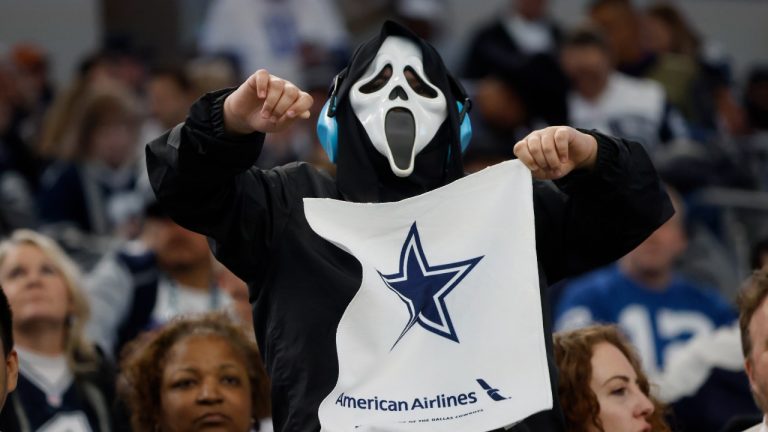 A Dallas Cowboys fan, dressed for Halloween, cheers during an NFL football game in Arlington. (Michael Ainsworth/AP)