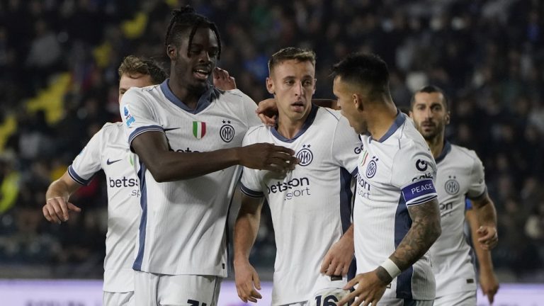 Inter's Davide Frattesi, center, celebrates scoring during the Serie A soccer match between Empoli and Inter Milan on Wednesday, Oct. 30, 2024. (Marco Bucco/LaPresse via AP)