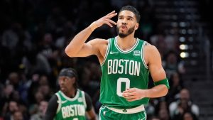 Boston Celtics forward Jayson Tatum (0) reacts after a three-point basket during the first half of an NBA basketball game against the Atlanta Hawks Thursday, March 28, 2024, in Atlanta. (John Bazemore/AP Photo)