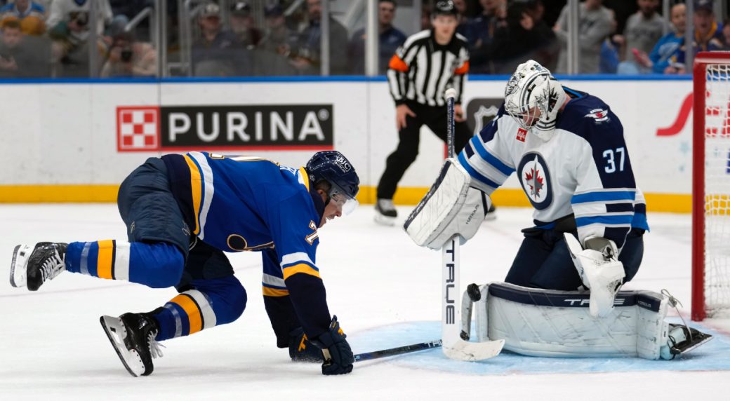 Hellebuyck stops 27 shots, lifts undefeated Jets to win over Blues