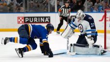 Hellebuyck stops 27 shots, lifts undefeated Jets to win over Blues